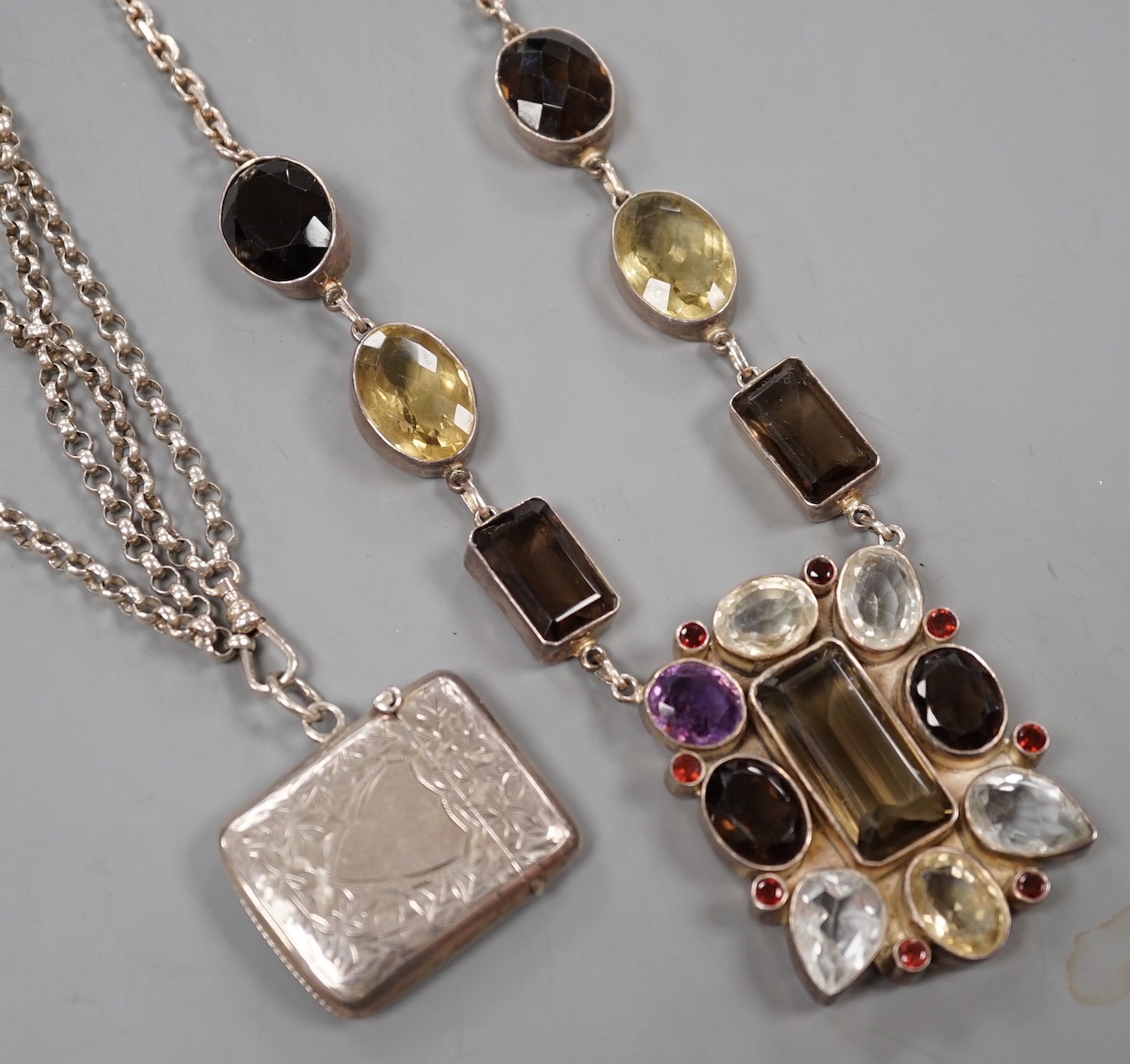 A large continental 925 white metal and multi-gem set rectangular pendant necklace, overall 72cm and a white metal double strand chain hung with a silver vesta case.